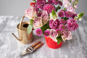 Finished flower arrangement in a vase for home. Flowers bunch, set for interior. Fresh cut flowers for decoration home. European floral shop. Delivery fresh cut flower.