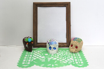 Sweet in the shape of a skull made of sugar, chocolate and amaranth as an offering for the Day of...