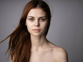 Fototapeta premium beautiful woman red hair naked shoulders posing posing isolated background