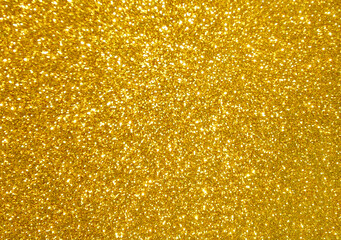 Golden yellow glitter bokeh background.  Photo can be used for New Year, Christmas and all...