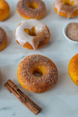 Freshly baked Home made Pumpkin Spice Donuts a table