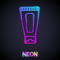 Glowing neon line Cream or lotion cosmetic tube icon isolated on black background. Body care products for woman. Vector