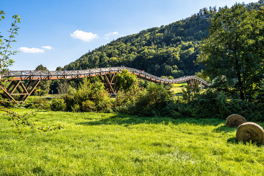 Wooden bridge Tatzelwurm in Essing at Altmuehl river below the ruins of Randeck Castle, Bavaria, Germany