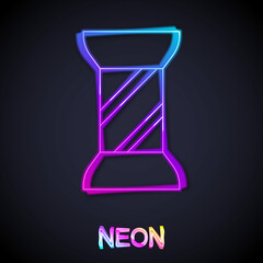 Glowing neon line Sewing thread on spool icon isolated on black background. Yarn spool. Thread bobbin. Vector