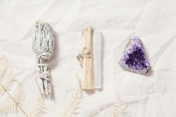 Palo Santo sticks with selenite, dried sage and druse amethyst on linen