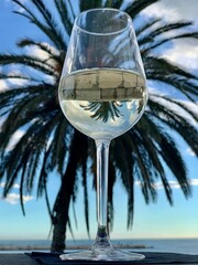 glass of champagne on beach