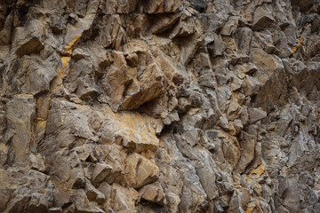 Volumetric rock texture. Mountain surface. Close-up. Stone background for design.