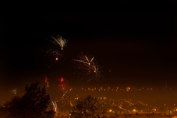 Fireworks over a city at night