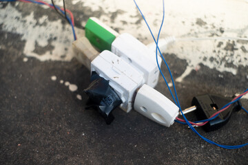 harzardous electrical plug connections with multiple outlets which overloads and causes a safety risk and overuse leads to energy crisis