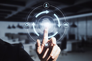 Close up of businessman hand pointing at abstract glowing fingerprint id scanning interface on blurry office background. Biometrics and safety concept. Double exposure.
