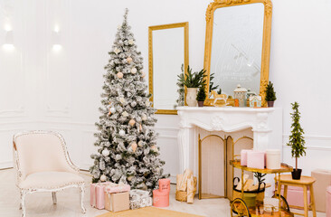 New Year interior in a photo studio. Christmas tree near the fireplace