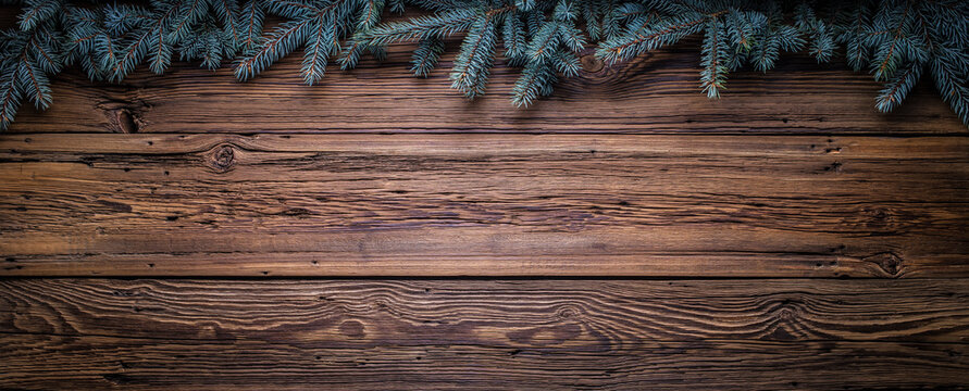 Cozy Christmas copy space background with spruce branches and barn wood