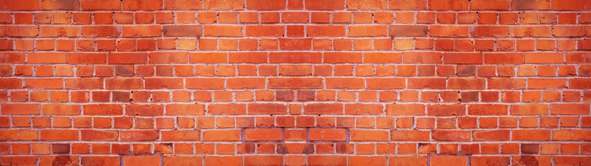 Orange red damaged rustic brick wall brickwork stonework masonry texture background banner panorama.