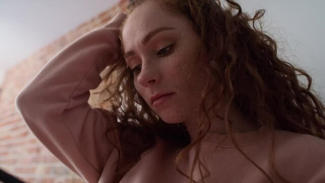 Close up and low angle video of anxious young caucasian woman using mobile phone. Shot with RED helium camera in 8K.
