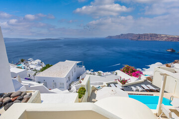 Beautiful Santorini landscape with white architecture and sea view. Sunny summer travel background, cityscape, urban scenic. Idyllic streets, pathway, pool and houses. Luxury resort hotel vacation