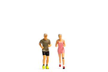 Miniature people running on white background , Healthy lifestyle and sport concepts.
