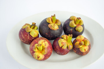 Fresh Mangosteen fruit isolated on white background.