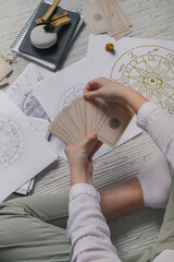Astrology. Astrologer calculates natal chart and makes a forecast of fate.Tarot cards, Fortune telling on tarot cards magic crystal, occultism, Esoteric background. Fortune telling,tarot predictions.
