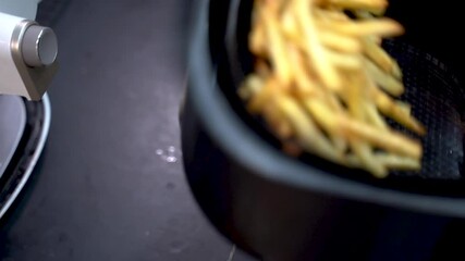 French fries cooked by airfryer at home. Healthy food for diet eating.