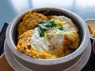 Deep fried pork cutlet and egg on a rice in a metal bowl (Zao, Katta-gun, Miyagi, Japan)