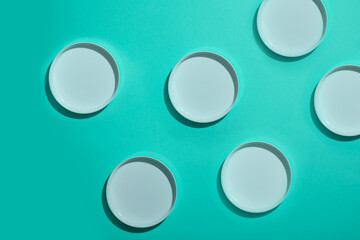 A pattern of white caps on a turquoise background. the concept of cosmetology, spa and massage.
