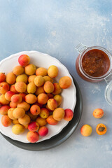 Overhead view freshly picked apricots plate