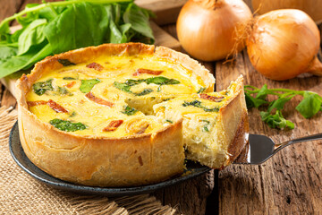 Spinach quiche with onion and bacon.