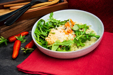Fresh and tasty tartare of raw salmon prepared with salmons eggs and vegetables
