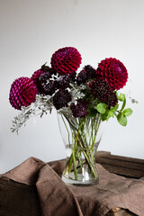 Dahlias bouquet on a wooden table - 466900577