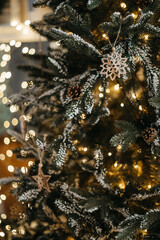 Christmas decorations hanging on fir tree. christmas tree detail