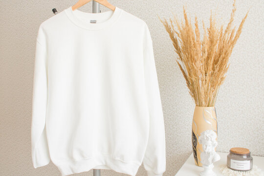 White mockup with blank sweatshirt and pampas grass on the boho background.
