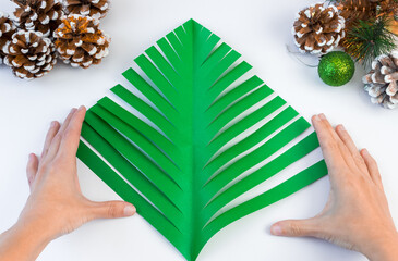 How to make a creative Christmas tree from colored paper and glue with your own hands. DIY concept....