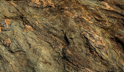 Natural stone or rock background ,granite metamorphic rock weathered on beach .