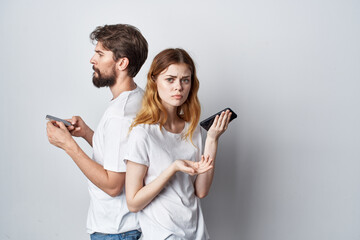 married couple family with phones in hand communication isolated background