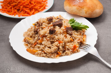 pilaf with beef with carrots and bread