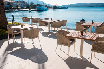 Empty chair and table with outdoor view. Tivat Porto Montenegro
