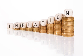 Rising inflation rate with coins and the word inflation