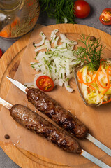 lula kebab with pickled onions and cabbage salad