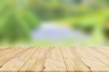 wood table on blur garden background