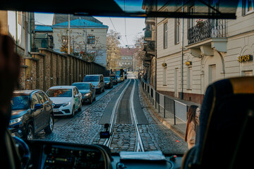 Lviv, Ukraine - Oktober 30, 2021. View of the streets of Lviv from tourist bus window. Travel concept. Sightseeing tour of historic old city center