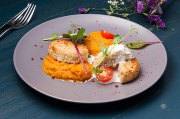 chicken cutlets with pumpkin puree with tomatoes and microgreens