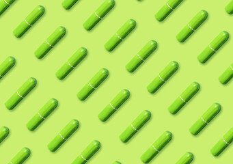 Many tampons on light green background, flat lay