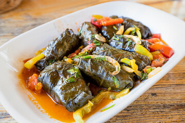 dolma is a large family of traditional dishes of grape leaf snacks stuffed minced meat. It is widespread in Transcaucasia and Turkey