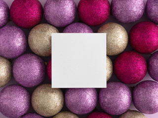 Pink, gold and purple glitter Christmas balls with copy space. Flat lay, top view. Christmas, winter, new year concept.