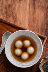 Sesame big tangyuan with syrup soup.