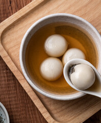 Sesame big tangyuan with syrup soup.