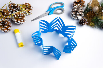 How to make a christmas snowflake from colored paper and glue with your own hands. DiY concept....