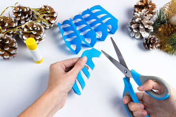 How to make a christmas snowflake from colored paper and glue with your own hands. DiY concept....