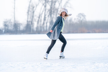 ice skating on a frozen pond in winter