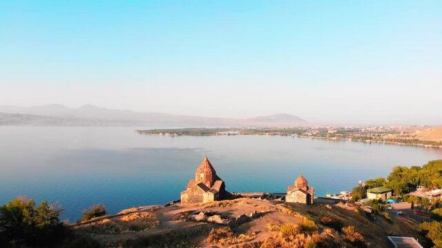 Aerial approaching view Armenian Monastery of Sevanavank, Lake Sevan Peninsula, Armenia